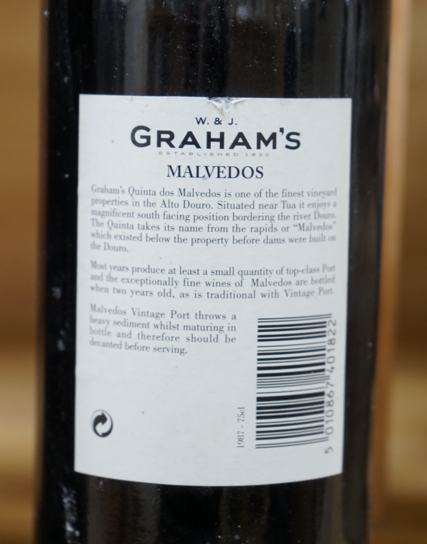 One bottle of Grahams 1963 port, label lacking, one bottle of Graham‘s Malvedos vintage port 1987 and one bottle of D’Oliveiras Vinho Madeira 1957 old wine (3) Condition - fair, storage history unknown